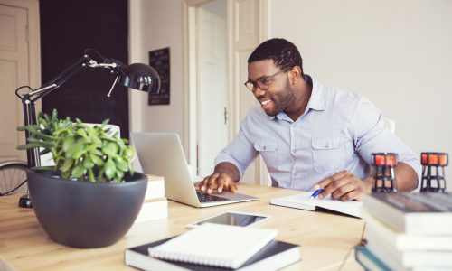 Afro american young man in a home office